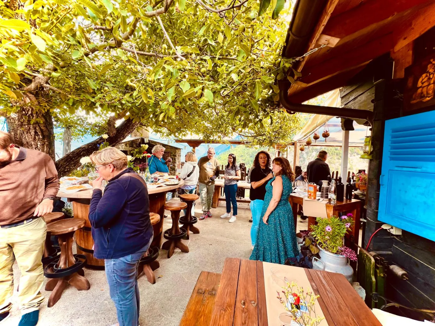 Lively terrace of Café des Promeneurs during the day with guests