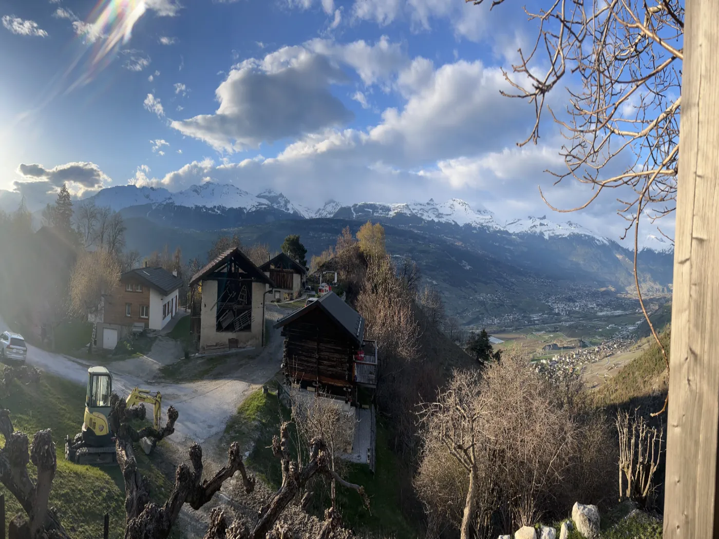Alpine panorama with chalets and snow-capped mountains